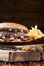 Tasty burger with fries and sauce Royalty Free Stock Photo