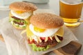 Tasty burgers with fried egg Royalty Free Stock Photo