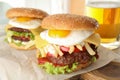 Tasty burgers with fried egg on board Royalty Free Stock Photo