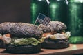 Tasty burgers with little usa flag and bottles on wooden kitchen desk Royalty Free Stock Photo