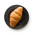 Tasty buttery croissant on plate.