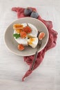 Tasty camembert with fresh figs and honey with honeycombs, decorated on a white wood plate background