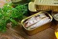 Tasty canned mackerel fish in sunflower oil with greens