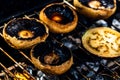 Tasty champignon  mushrooms and veggies being cooked on charcoal grill Royalty Free Stock Photo