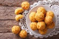 Tasty cheese buns gougere close-up on the table. Horizontal top