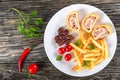 Tasty cheese meat Roll-Ups on dish, top view Royalty Free Stock Photo