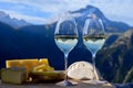 Tasty cheese and wine from Savoy region in France, beaufort, abondance, emmental, tomme and reblochon de savoie cheeses and glass