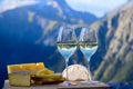 Tasty cheese and wine from Savoy region in France, beaufort, abondance, emmental, tomme and reblochon de savoie cheeses and glass