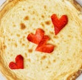 Tasty cheesecake with strawberry hearts, sweet food