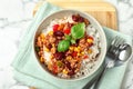 Tasty chili con carne served with rice on marble table Royalty Free Stock Photo