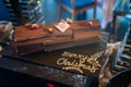 Tasty chocolate cake with merry christmas sign