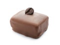Tasty chocolate candy with coffee bean on white background Royalty Free Stock Photo