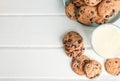 Tasty chocolate chip cookies and glass of milk on wooden table Royalty Free Stock Photo
