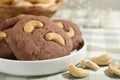 Tasty chocolate cookies with cashew on table, closeup Royalty Free Stock Photo