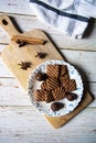 Tasty chocolate cookies and chocolates on a wooden platter Royalty Free Stock Photo