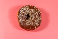 Tasty chocolate donut on pink background Royalty Free Stock Photo