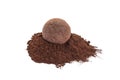 Tasty chocolate truffle with cacao powder on white background Royalty Free Stock Photo