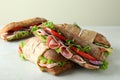 Tasty ciabatta sandwiches on white textured