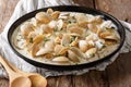 Tasty clams in a creamy sauce with garlic and greens close-up on Royalty Free Stock Photo