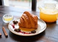 Tasty classic croissant with sea buckthorn teaa