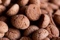 A tasty closeup portrait of a pile of delicious traditional dutch snacks called pepernoten or pepernuts. The gingerbread treat is