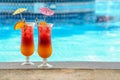 Tasty cocktails near swimming pool