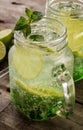 Tasty cold fresh drink lemonade with lemon, mint, ice and lime i Royalty Free Stock Photo