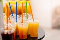 Tasty cold orange juice in plastic cup