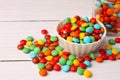 Tasty colorful candies on white wooden table, space for text Royalty Free Stock Photo