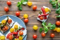 Tasty colorful lunch. Fresh cherry tomatoes yellow and red. Brown rustic background