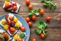 Tasty colorful lunch. Fresh cherry tomatoes yellow and red. Brown rustic background