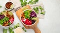 Tasty colorful vegan poke bowl on light gray background