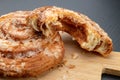 Tasty cookie broken in half. Fresh bread on a kitchen board Royalty Free Stock Photo