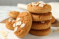 Tasty cookies with almond flakes on table, closeup Royalty Free Stock Photo