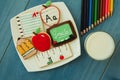 Tasty cookies with shape of school material