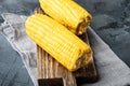 Tasty corn cobs, on gray stone background Royalty Free Stock Photo