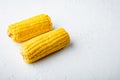 Tasty corn cobs, on white stone  background, with copy space for text Royalty Free Stock Photo