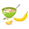 Tasty cornflakes in green bowl with spoon and banana and orange. Royalty Free Stock Photo