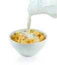 Tasty cornflakes in white bowl and glass of milk