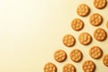 Tasty cracker biscuits on beige background, space for text