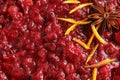 Tasty cranberry sauce with citrus zest and anise as background Royalty Free Stock Photo