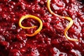 Tasty cranberry sauce with citrus zest as background Royalty Free Stock Photo