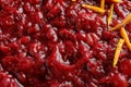 Tasty cranberry sauce with citrus zest as background Royalty Free Stock Photo
