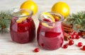 Tasty cranberry sauce with citrus zest in glass jars Royalty Free Stock Photo