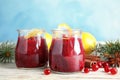 Tasty cranberry sauce with citrus zest in glass jars Royalty Free Stock Photo
