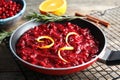 Tasty cranberry sauce with citrus zest in pan Royalty Free Stock Photo