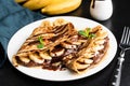 Tasty crepe with hazelnut chocolate spread and banana