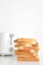 Tasty, crispy browned toast near toaster Royalty Free Stock Photo