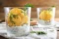 Tasty crispy potato chips with sour cream and dill in glass Royalty Free Stock Photo