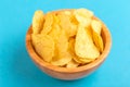 Tasty crispy potato chips in wooden bowl Royalty Free Stock Photo
